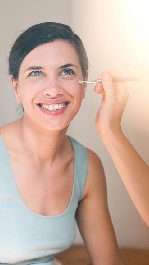woman applying cream