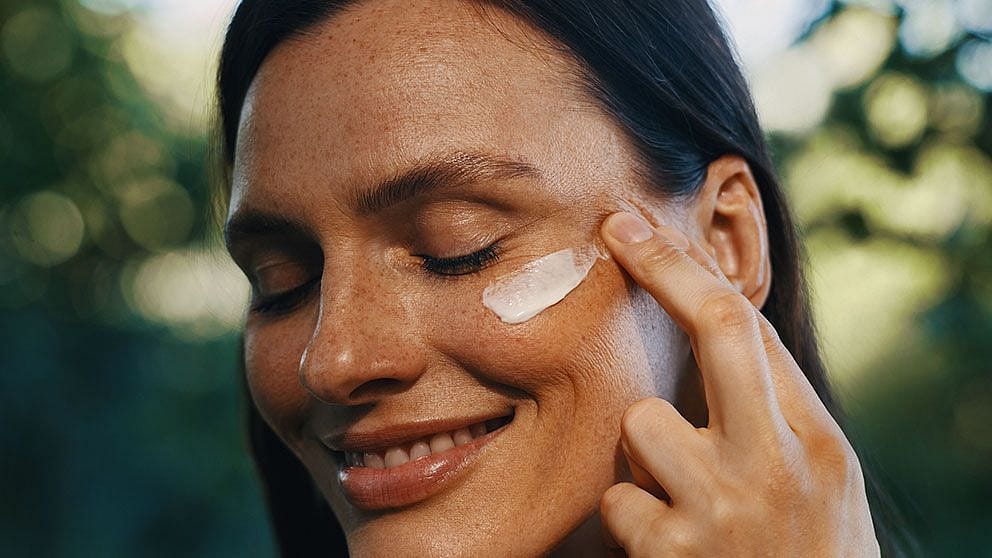 woman applying cream